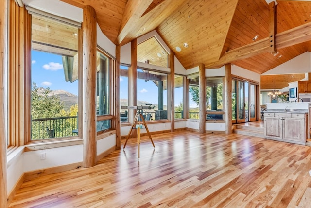 731 Lakeview Cir, Silverthorne, CO 80498 - unfurnished sunroom with wood finished floors, baseboards, wood ceiling, a mountain view, and a chandelier