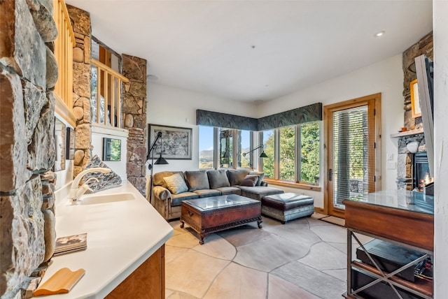 731 Lakeview Cir, Silverthorne, CO 80498 - living area featuring a fireplace and light tile patterned floors
