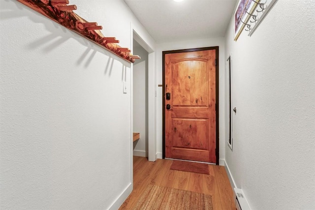 720 Columbine Rd Unit 104, Breckenridge, CO 80424 - doorway to outside with light wood-style flooring and baseboards