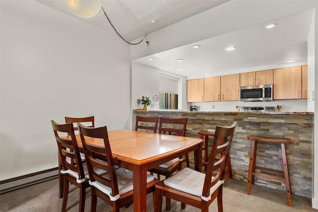 720 Columbine Rd Unit 104, Breckenridge, CO 80424 - dining area featuring a baseboard heating unit, light carpet, and recessed lighting