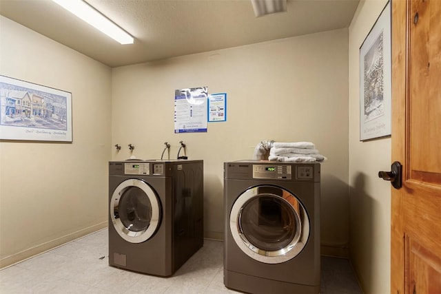 720 Columbine Rd Unit 104, Breckenridge, CO 80424 - washroom featuring separate washer and dryer and baseboards