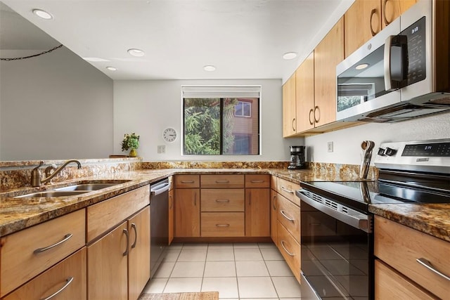 720 Columbine Rd Unit 104, Breckenridge, CO 80424 - kitchen featuring appliances with stainless steel finishes, a sink, dark stone counters, light tile patterned flooring, and recessed lighting