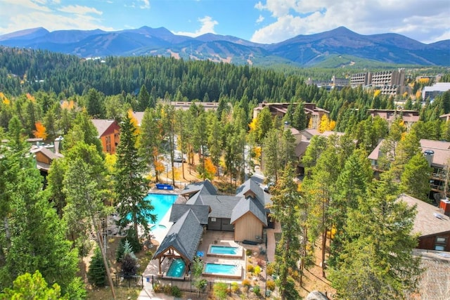 720 Columbine Rd Unit 104, Breckenridge, CO 80424 - bird's eye view of mountains, a pool area, and a forest