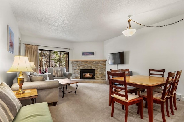720 Columbine Rd Unit 104, Breckenridge, CO 80424 - carpeted living area with a textured ceiling and a stone fireplace