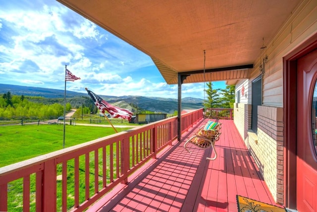 420 County Rd 130, Kremmling, CO 80459 - deck with a mountain view and a lawn