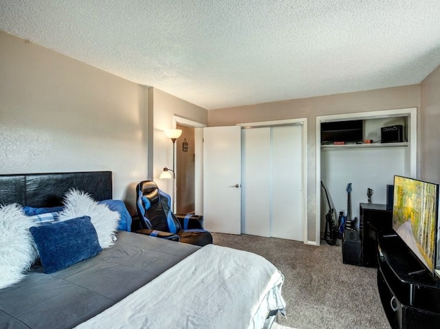 420 County Rd 130, Kremmling, CO 80459 - bedroom with a textured ceiling, carpet, and two closets