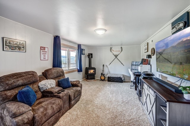 420 County Rd 130, Kremmling, CO 80459 - carpeted living room featuring a wood stove and baseboards