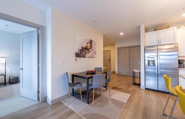 75 W 4th St Unit 206, Silverthorne, CO 80497 - dining room featuring light wood finished floors, recessed lighting, and baseboards