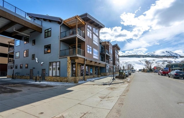 75 W 4th St Unit 206, Silverthorne, CO 80497 - snow covered property with a mountain view and a view of apartment building / complex