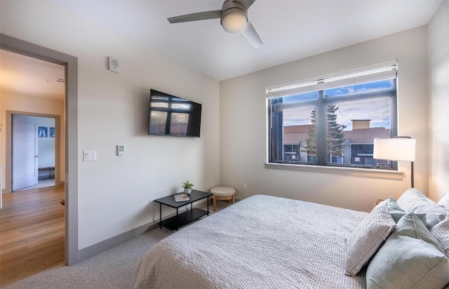 75 W 4th St Unit 206, Silverthorne, CO 80497 - bedroom with baseboards, ceiling fan, and light wood-style flooring