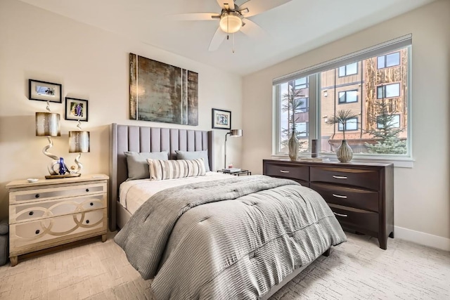 bedroom featuring ceiling fan and baseboards