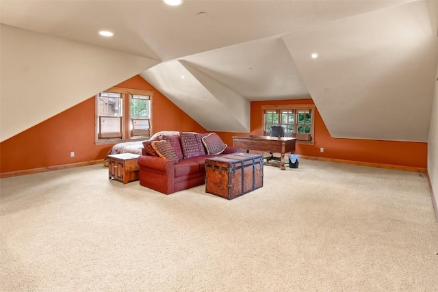 interior space with recessed lighting, lofted ceiling, plenty of natural light, and carpet