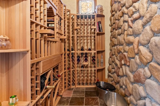 wine room with stone finish flooring