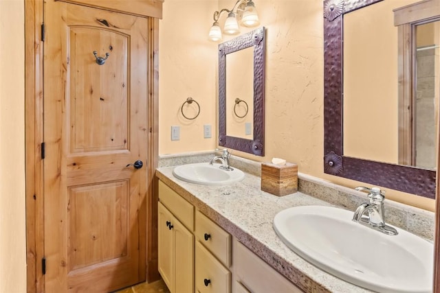 bathroom with double vanity and a sink