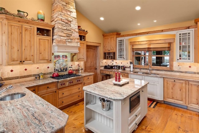 kitchen featuring a sink, decorative backsplash, open shelves, and stainless steel appliances