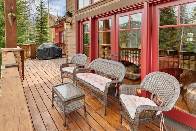 wooden terrace featuring area for grilling