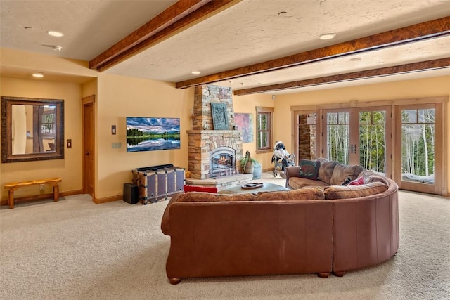 living area with a stone fireplace, carpet, recessed lighting, baseboards, and beamed ceiling