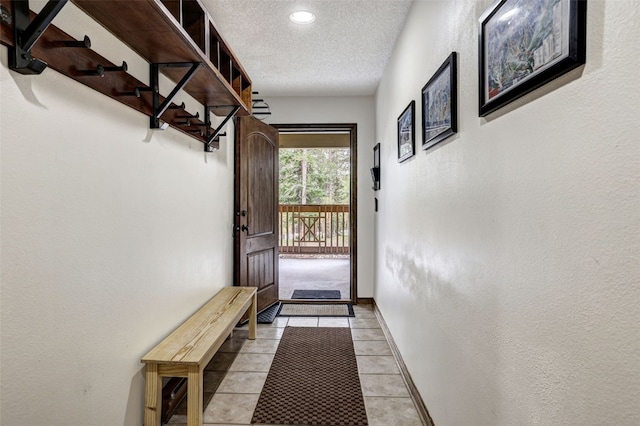 840 Four Oclock Rd Unit A1D, Breckenridge, CO 80424 - entryway featuring a textured ceiling, recessed lighting, and light tile patterned floors