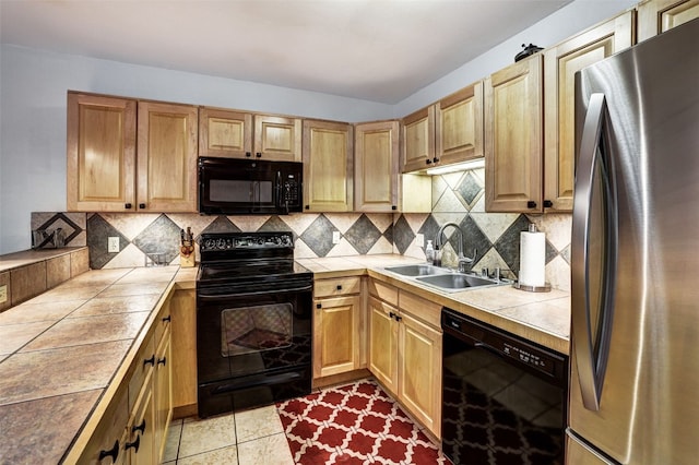 840 Four Oclock Rd Unit A1D, Breckenridge, CO 80424 - kitchen featuring black appliances, tile countertops, and backsplash
