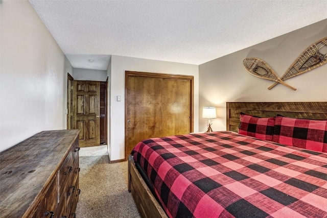 840 Four Oclock Rd Unit A1D, Breckenridge, CO 80424 - bedroom featuring carpet flooring, a closet, and a textured ceiling