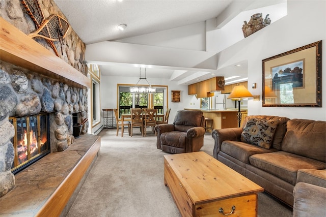 203 Creekside Dr Unit 201, Frisco, CO 80443 - living room with light carpet, a stone fireplace, and lofted ceiling