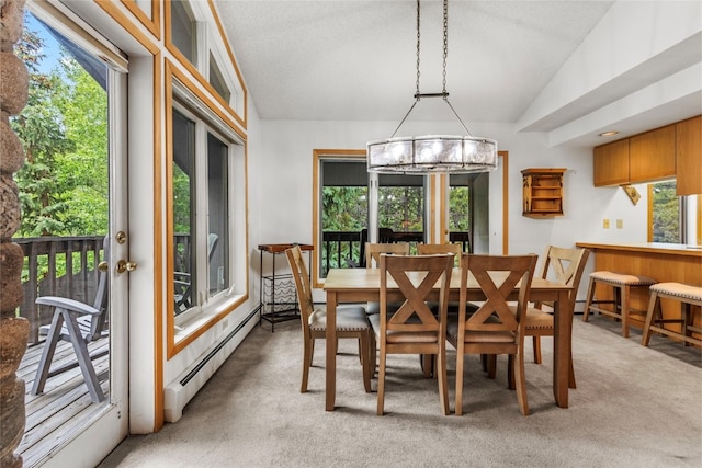 203 Creekside Dr Unit 201, Frisco, CO 80443 - dining room featuring baseboard heating, light carpet, lofted ceiling, and a chandelier