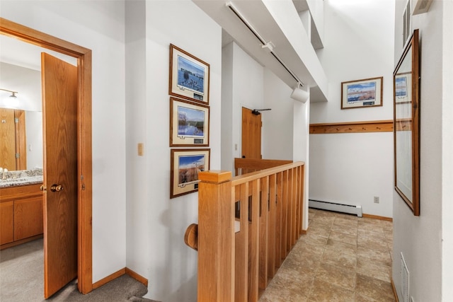 203 Creekside Dr Unit 201, Frisco, CO 80443 - corridor with a baseboard heating unit and an upstairs landing