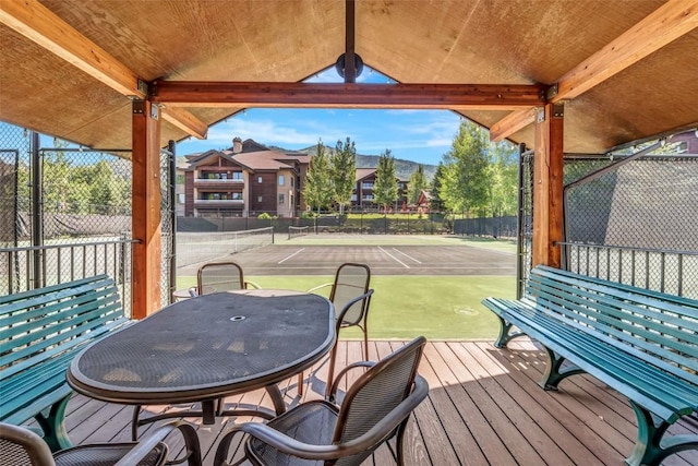 wooden deck with fence and outdoor dining space