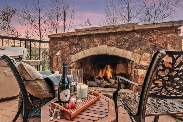 exterior space with an outdoor stone fireplace