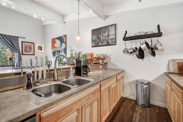 471 Enterprise St Unit C, Hayden, CO 81639 - kitchen featuring rail lighting, dark wood finished floors, light brown cabinetry, and hanging light fixtures