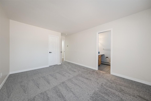 1921 Walton Creek Rd Unit 4, Steamboat Springs, CO 80487 - empty room featuring light carpet and a baseboard radiator