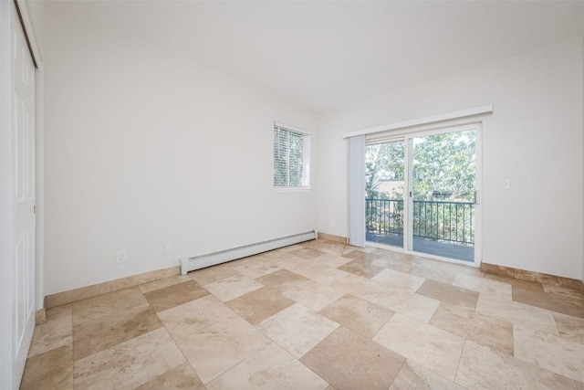 1921 Walton Creek Rd Unit 4, Steamboat Springs, CO 80487 - empty room featuring baseboard heating and light stone finish flooring