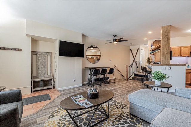 1920 Ski Time Square Dr Unit 315, Steamboat Springs, CO 80487 - living area featuring stairs, light wood finished floors, a ceiling fan, recessed lighting, and baseboards