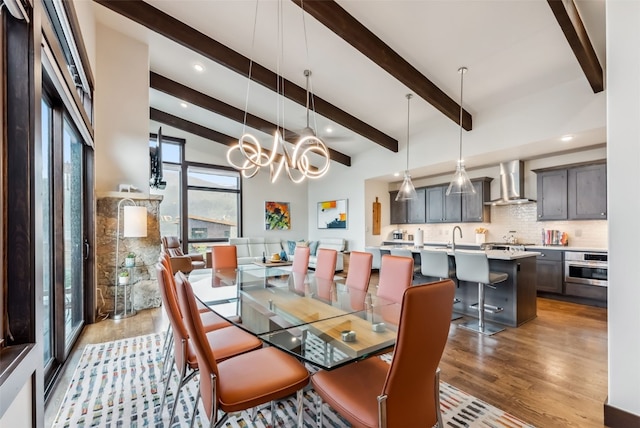 14 E Baron Way, Silverthorne, CO 80498 - dining room with light wood-style flooring, beam ceiling, a chandelier, and recessed lighting