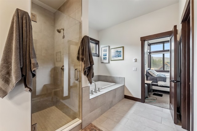 14 E Baron Way, Silverthorne, CO 80498 - full bathroom with ensuite bathroom, a stall shower, a garden tub, tile patterned floors, and baseboards