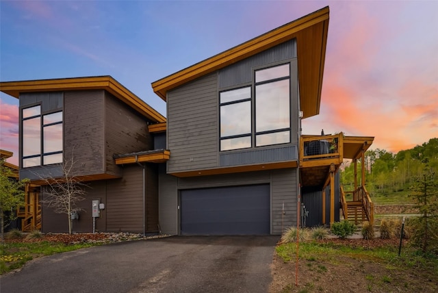 14 E Baron Way, Silverthorne, CO 80498 - contemporary home featuring stairway, a garage, and asphalt driveway
