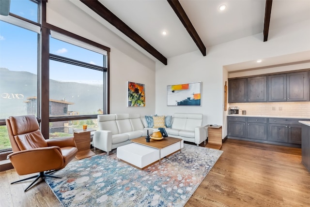 14 E Baron Way, Silverthorne, CO 80498 - living area with healthy amount of natural light, beamed ceiling, light wood-type flooring, and recessed lighting