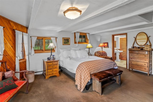 27845 County Road 41a, Steamboat Springs, CO 80487 - carpeted bedroom featuring beamed ceiling, baseboard heating, and connected bathroom