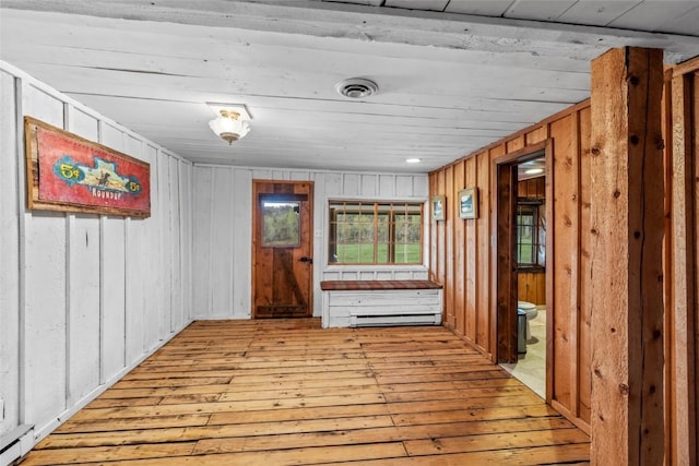 27845 County Road 41a, Steamboat Springs, CO 80487 - hall featuring light wood-style flooring, healthy amount of natural light, wooden walls, and a baseboard heating unit