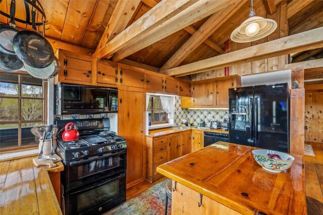 27845 County Road 41a, Steamboat Springs, CO 80487 - kitchen with black appliances, hardwood / wood-style floors, tasteful backsplash, wooden ceiling, and butcher block counters
