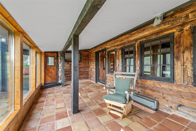 27845 County Road 41a, Steamboat Springs, CO 80487 - unfurnished sunroom with baseboard heating and wooden walls