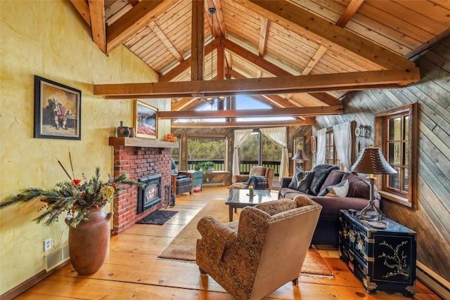 27845 County Road 41a, Steamboat Springs, CO 80487 - living room featuring a baseboard heating unit, beam ceiling, hardwood / wood-style floors, a fireplace, and wooden ceiling