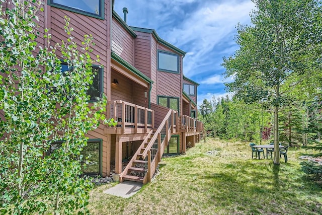 exterior space with stairway and a wooden deck