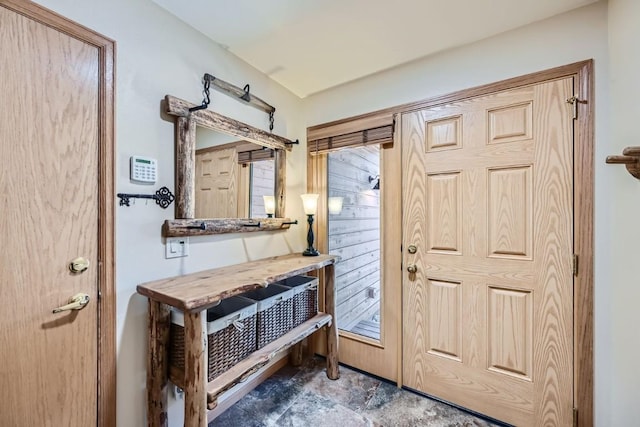 foyer entrance featuring stone finish floor
