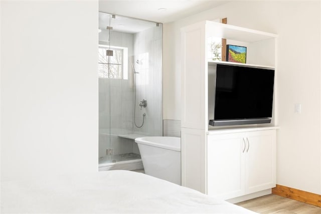 186 Rachel Ln, Breckenridge, CO 80424 - bathroom with a freestanding bath, a shower stall, baseboards, and wood finished floors