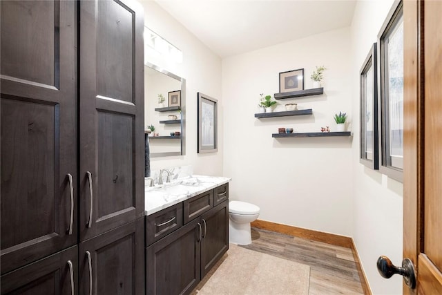 186 Rachel Ln, Breckenridge, CO 80424 - bathroom featuring toilet, vanity, wood finished floors, and baseboards