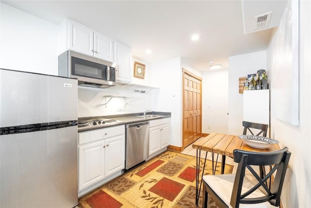 186 Rachel Ln, Breckenridge, CO 80424 - kitchen featuring a sink, stainless steel appliances, white cabinetry, visible vents, and recessed lighting