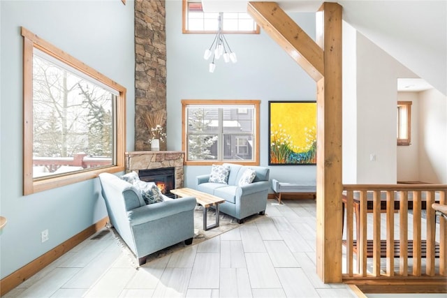 186 Rachel Ln, Breckenridge, CO 80424 - interior space with baseboards, a high ceiling, and a fireplace