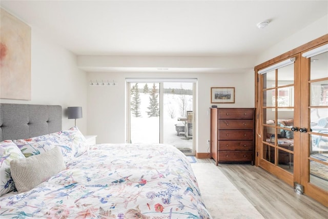 186 Rachel Ln, Breckenridge, CO 80424 - bedroom with wood finished floors, access to outside, and french doors