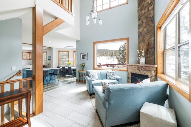 186 Rachel Ln, Breckenridge, CO 80424 - living room with a stone fireplace, a towering ceiling, and light tile patterned floors